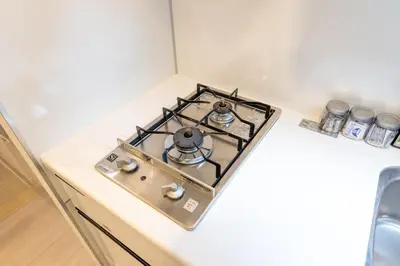 a stove top oven sitting on top of a counter at LIVCITY Kinshicho 701 in Tokyo