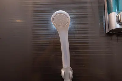 a white toothbrush sitting on top of a table at Sohome Otsuka Hotel in Tokyo