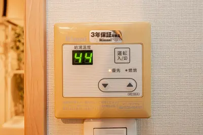 an electronic clock on the side of a wall at Sohome Otsuka Hotel in Tokyo