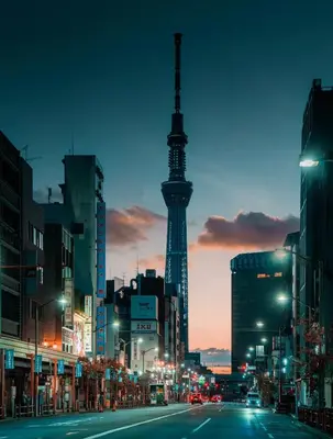 a city street with a view of the eiffel tower at RShotel in Tokyo