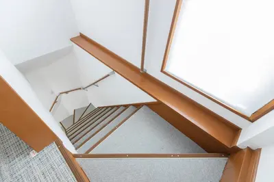 a stairwell in a house with wood and glass at KS Mukoujima in Tokyo