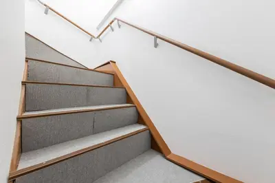 a staircase in a house with wood and white walls at KS Mukoujima in Tokyo