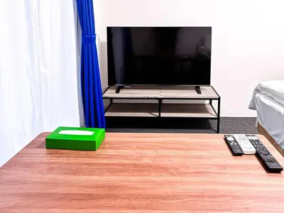 a living room with a tv on a table at 3mins to Oshiage station and Tokyo Skytree in Tokyo