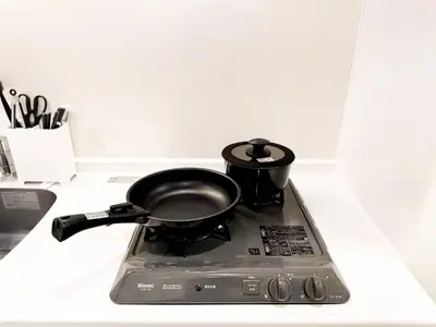 a black pot sitting on top of a stove at 3mins to Oshiage station and Tokyo Skytree in Tokyo