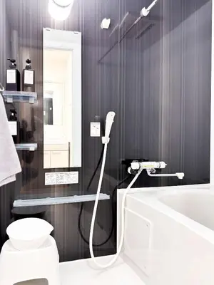 a bathroom with a tub and a toilet and a sink at 3mins to Oshiage station and Tokyo Skytree in Tokyo