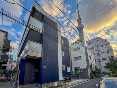 a building with a tower in the background at 3mins to Oshiage station and Tokyo Skytree in Tokyo