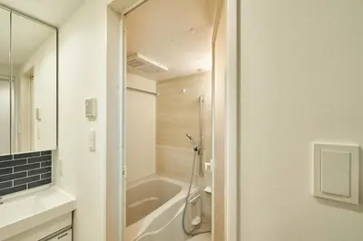 a bathroom with a shower and a bath tub at livecasa\u8535\u524d brand-new hotel, a 3-minute walk from Asakusa Kuramae Statio in Tokyo