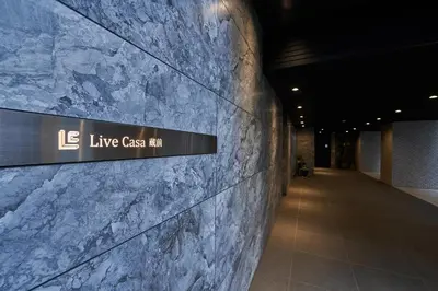 a sign on the wall of a building at livecasa\u8535\u524d brand-new hotel, a 3-minute walk from Asakusa Kuramae Statio in Tokyo