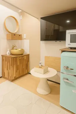 a kitchen with a sink and a microwave at \u8aa0\u5bb6 Makoto Hotel in Tokyo