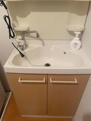 a bathroom sink with a faucet on top of it at Walk to JR Shinjuku - Grand Écru II 605 - Balcony & Kitchen in Tokyo