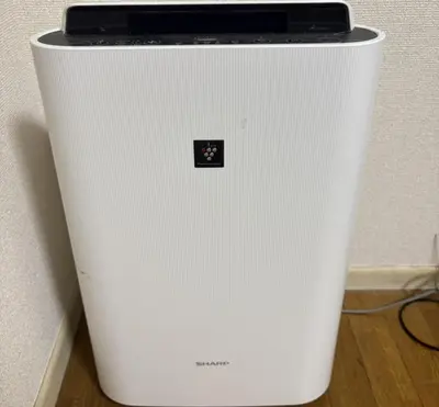 a white refrigerator sitting next to a wall at RHK Guest House102 in Tokyo