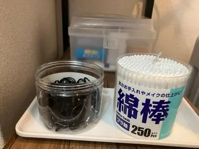 a refrigerator with a jar and a container of food at Park side tango in Tokyo