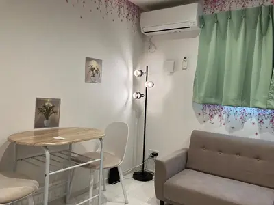 a living room with a table and a couch at Park side tango in Tokyo