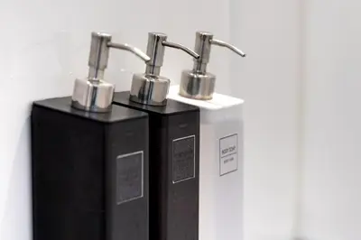 two black boxes with two faucets on a wall at \u3059\u307f\u308c\u306e\u5bbf in Tokyo
