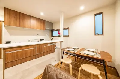 a kitchen and dining room with a table and chairs at Shibuya House in Tokyo