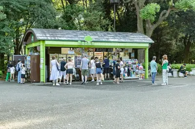 a group of people standing outside of a store at Shibuya House in Tokyo