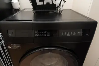 a black washing machine with a basket on top of it at ORIENS SHIBUYA Stylish Apt - Steps to Scramble crossing - Foodie hub Ebisu & Daikanyama in Tokyo