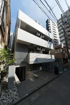a white building with a balcony on a street at ORIENS SHIBUYA Stylish Apt - Steps to Scramble crossing - Foodie hub Ebisu & Daikanyama in Tokyo