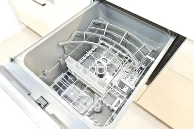 an open dishwasher in a drawer in a kitchen at Zen Luxe in Tokyo