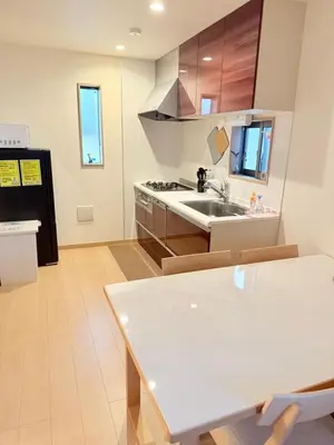 a kitchen with a sink and a stove at 池袋銀婚屋 GINKOU's HOUSE -- 2 min train to Ikebukuro Sunshine City in Tokyo