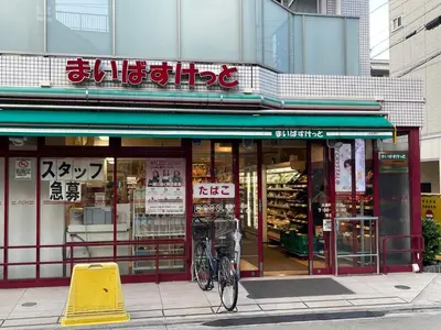 a bike parked in front of a store at Omorinishi 3chome House in Tokyo