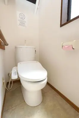 a bathroom with a white toilet in a room at Omorinishi 3chome House in Tokyo