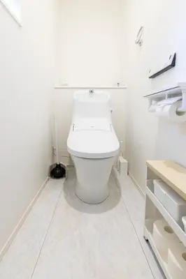 a white bathroom with a toilet in a room at Akabanenishi 3chome House in Tokyo