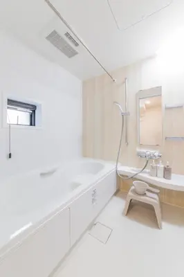 a bathroom with a tub and a toilet and a sink at Akabanenishi 3chome House in Tokyo