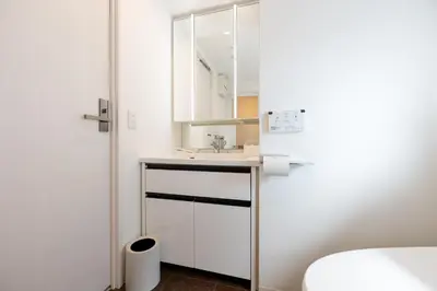a bathroom with a sink and a mirror at LIVCITY Kinshicho 1101 Skytree view in Tokyo