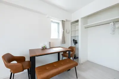 a home office with a desk and two chairs at LIVCITY Kinshicho 1101 Skytree view in Tokyo