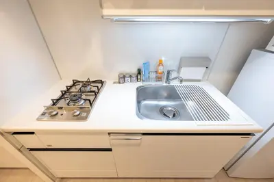 a kitchen with a sink and a stove at LIVCITY Kinshicho 1101 Skytree view in Tokyo
