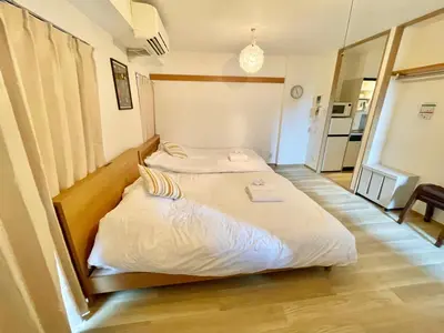 a bedroom with two beds in a room at YMK Oshiage 7B in Tokyo