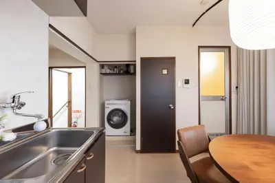 a kitchen and dining room with a sink and a table at \u3077\u3075\u304b\u767d\u9b1a in Tokyo