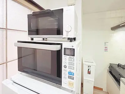 a microwave oven sitting on top of a counter at Tokyo Stay West Sugamo #102 in Tokyo
