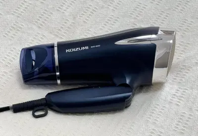 a black hair dryer sitting on a table at \u30a2\u30b9\u30d4\u30a2502 7-minute walk from Nishi-Sugamo Station 9-minute walk from Sugamo Station 1-minute walk from Koshinzuka WiFi available in Tokyo
