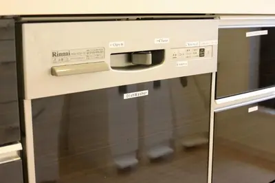 a microwave oven sitting next to a stove at \u304b\u307e\u3082\u30551 in Tokyo