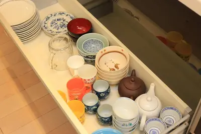 a drawer full of dishes and cups and plates at \u304b\u307e\u3082\u30551 in Tokyo