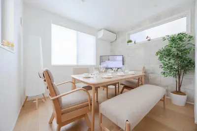 a dining room with a table and chairs at First Choice Minami Kamata in Tokyo