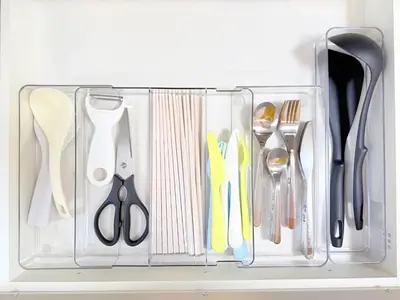 a plastic container with scissors and other kitchen utensils at \u5409\u5c4b2\u53f7\u9928 in Tokyo