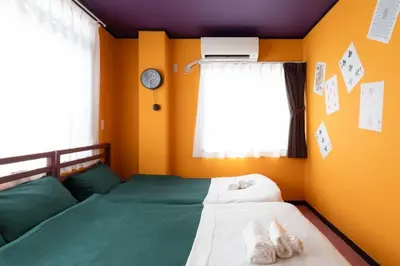 a bedroom with a bed with shoes on it at Private house 100sqm with bicycles Disney 30min in Tokyo