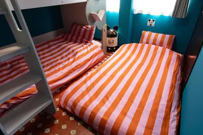 two beds in a room with a bunk bed at Private house 100sqm with bicycles Disney 30min in Tokyo