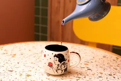 a drink is being poured into a coffee cup on a table at Private house 100sqm with bicycles Disney 30min in Tokyo