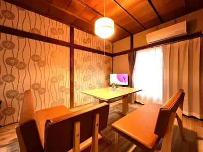 a room with a table and a desk and a window at Akabane Nishi kodate AN1 in Wada