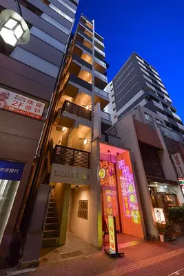 a building in a city with tall buildings at \u539f\u7530\u5c4b Hotel 7F in Tokyo
