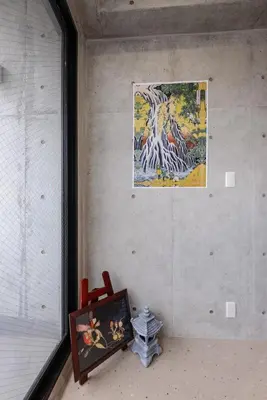 a room with a painting on the wall and a chair at \u539f\u7530\u5c4b Hotel 7F in Tokyo
