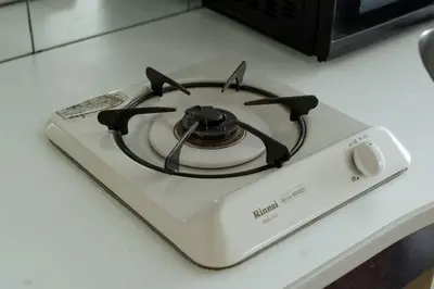 a stove top oven sitting on top of a counter at Kabukicho Queen Bed Hotel in Tokyo
