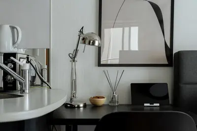 a kitchen with a desk with a lamp and a sink at Kabukicho Queen Bed Hotel in Tokyo