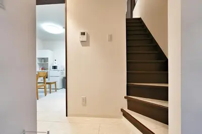 a staircase in a house with a mirror at miraisya shinkoiwa in Tokyo