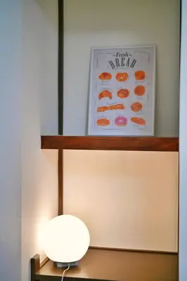 a lamp sitting on a table next to a wall at miraisya shinkoiwa in Tokyo