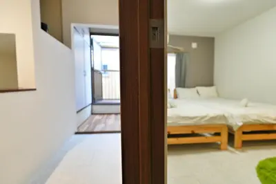 a view of a bedroom with a bed and a window at miraisya shinkoiwa in Tokyo